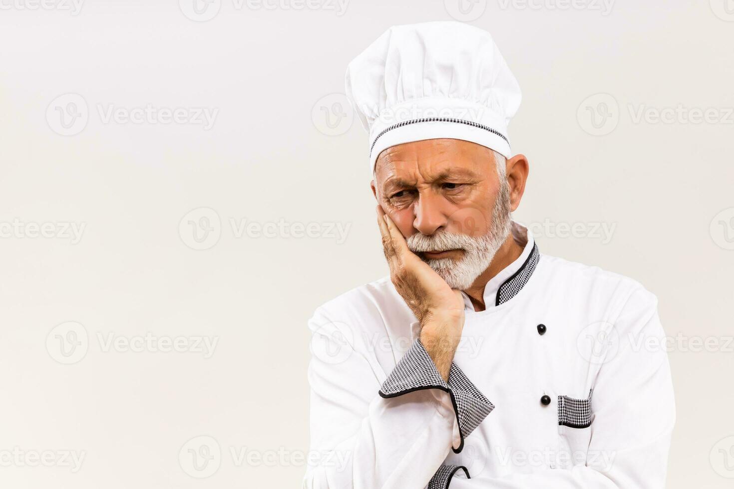 Image of sad chef on gray background. photo
