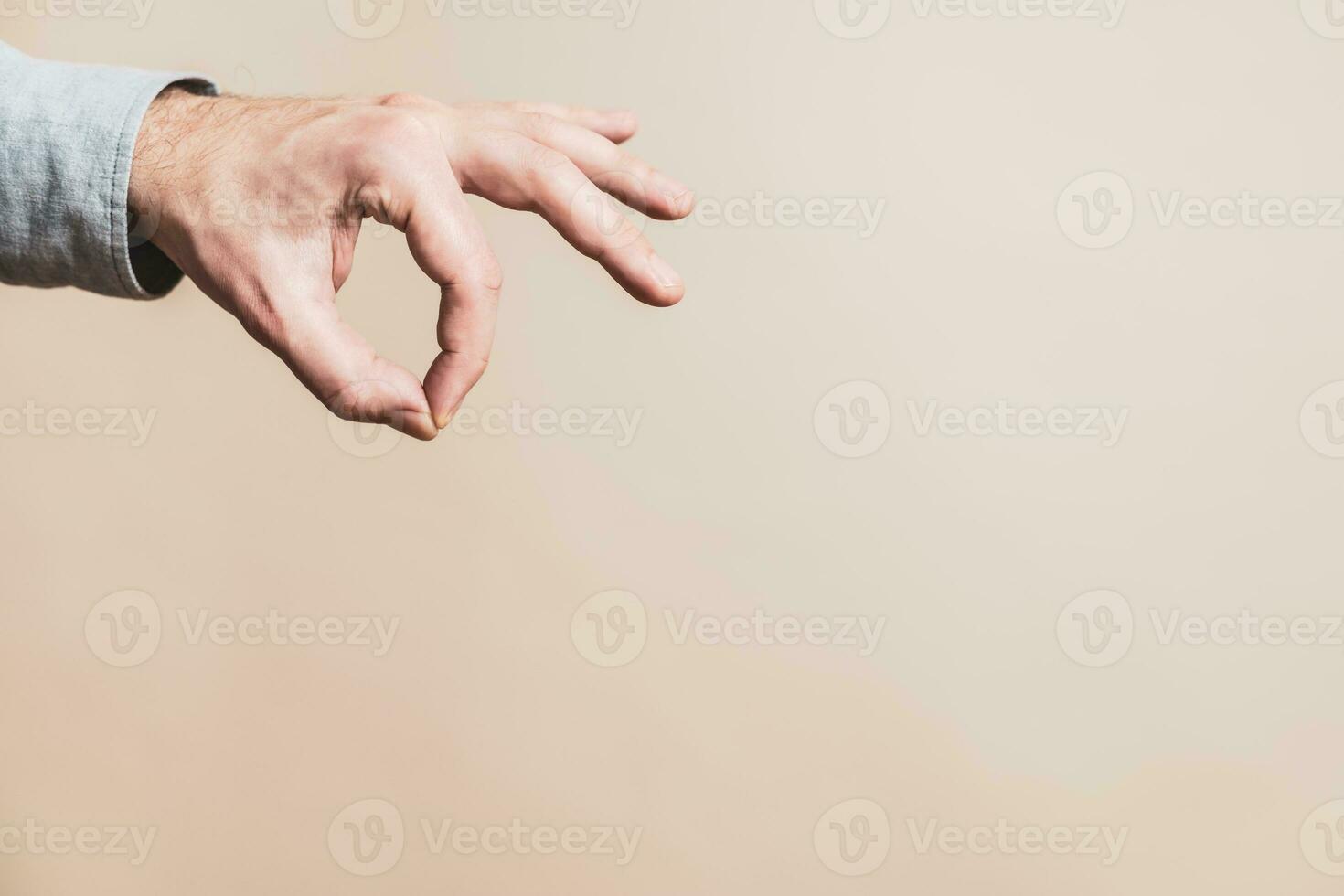 Close up image of male hand in picking gesture. photo