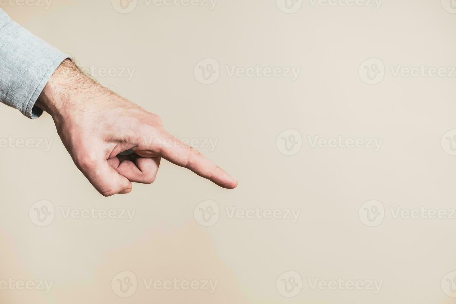 Close up image of male hand pointing. photo