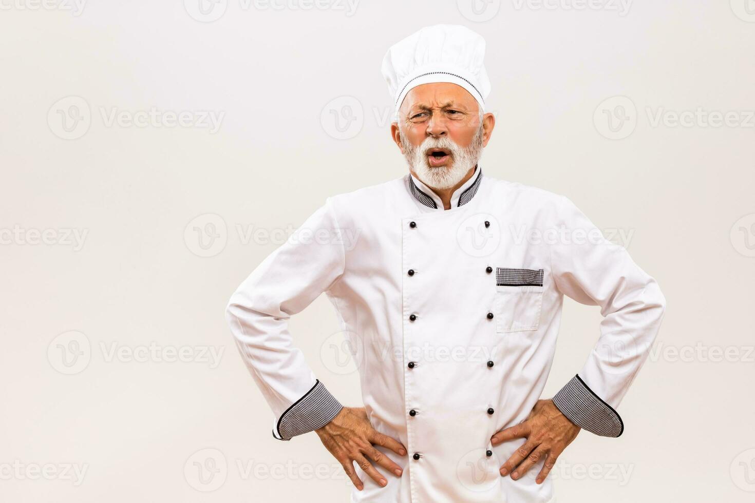 Image of exhausted senior chef on gray background. photo