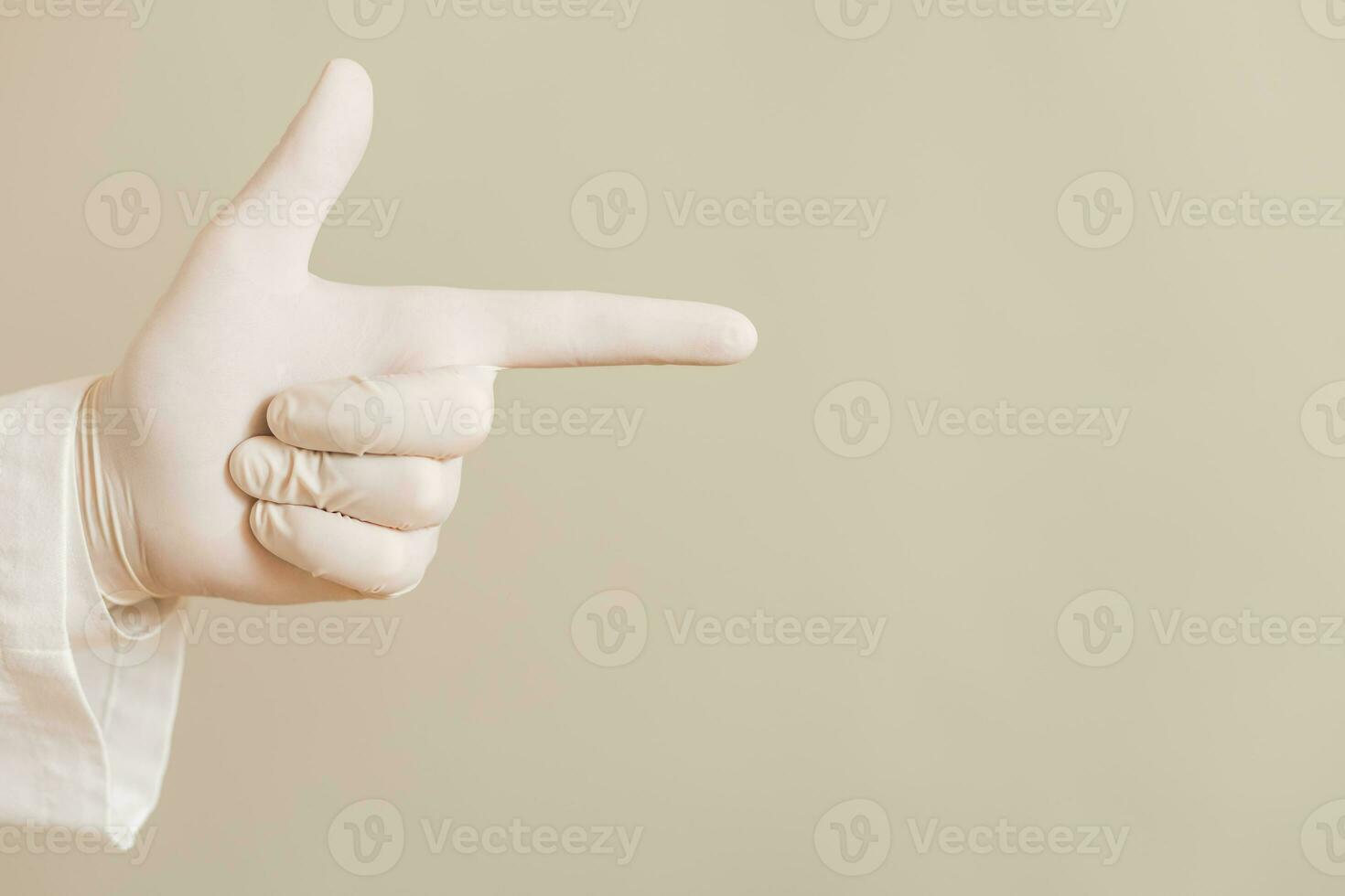Image of close up hand in protective glove  of doctor pointing. photo