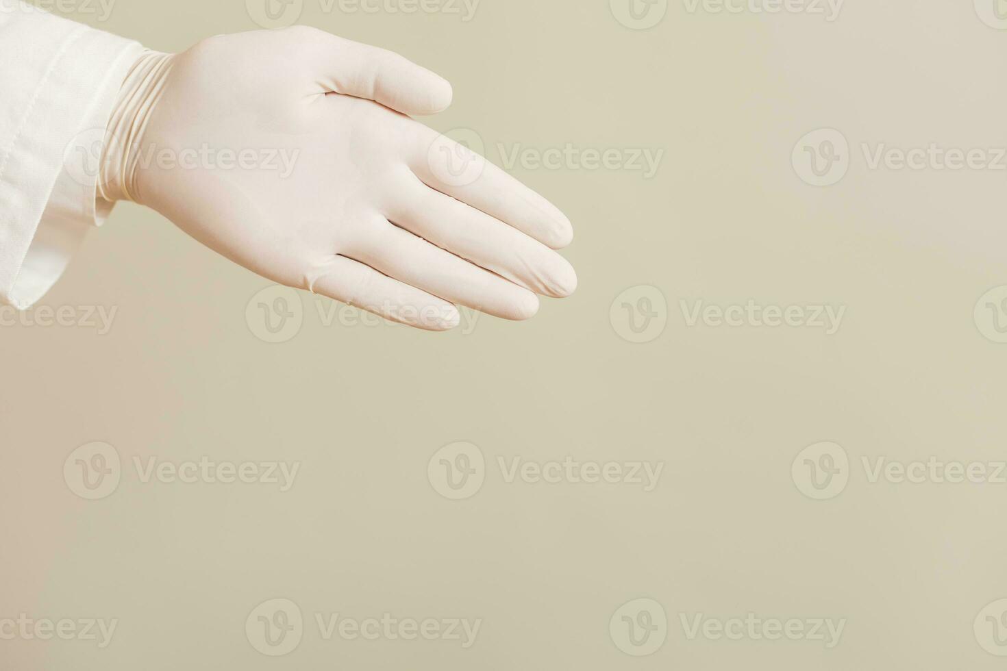 Image of close up hand in protective glove of doctor showing. photo