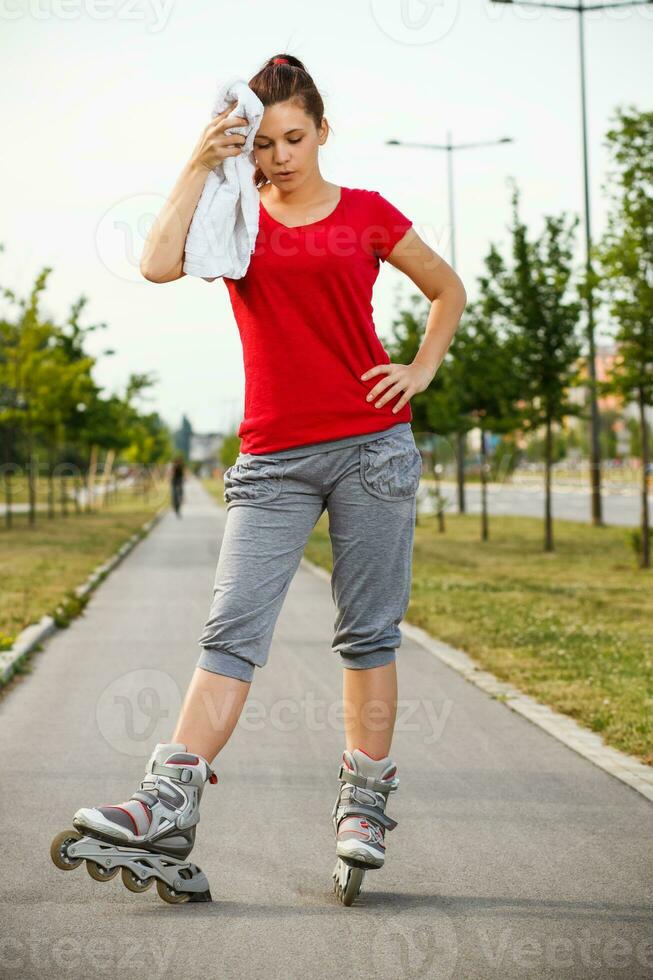 Tired girl on roller skates photo
