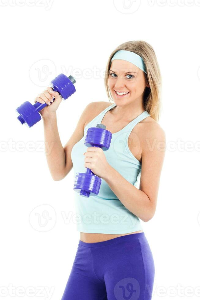 Sporty woman exercising with weights photo