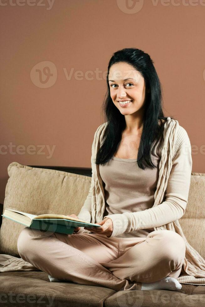 Young woman reading book photo