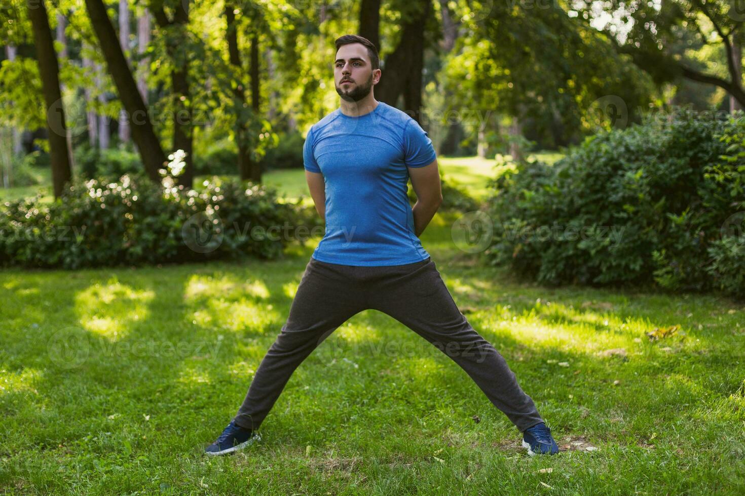Handsome man practicing  in the park. photo
