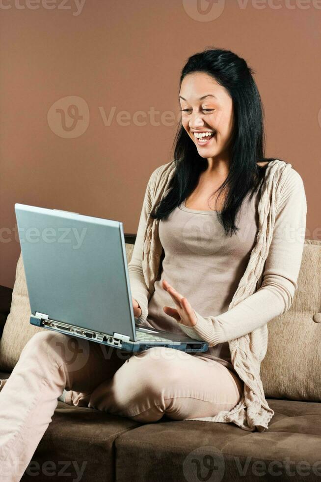 Young woman using laptop photo