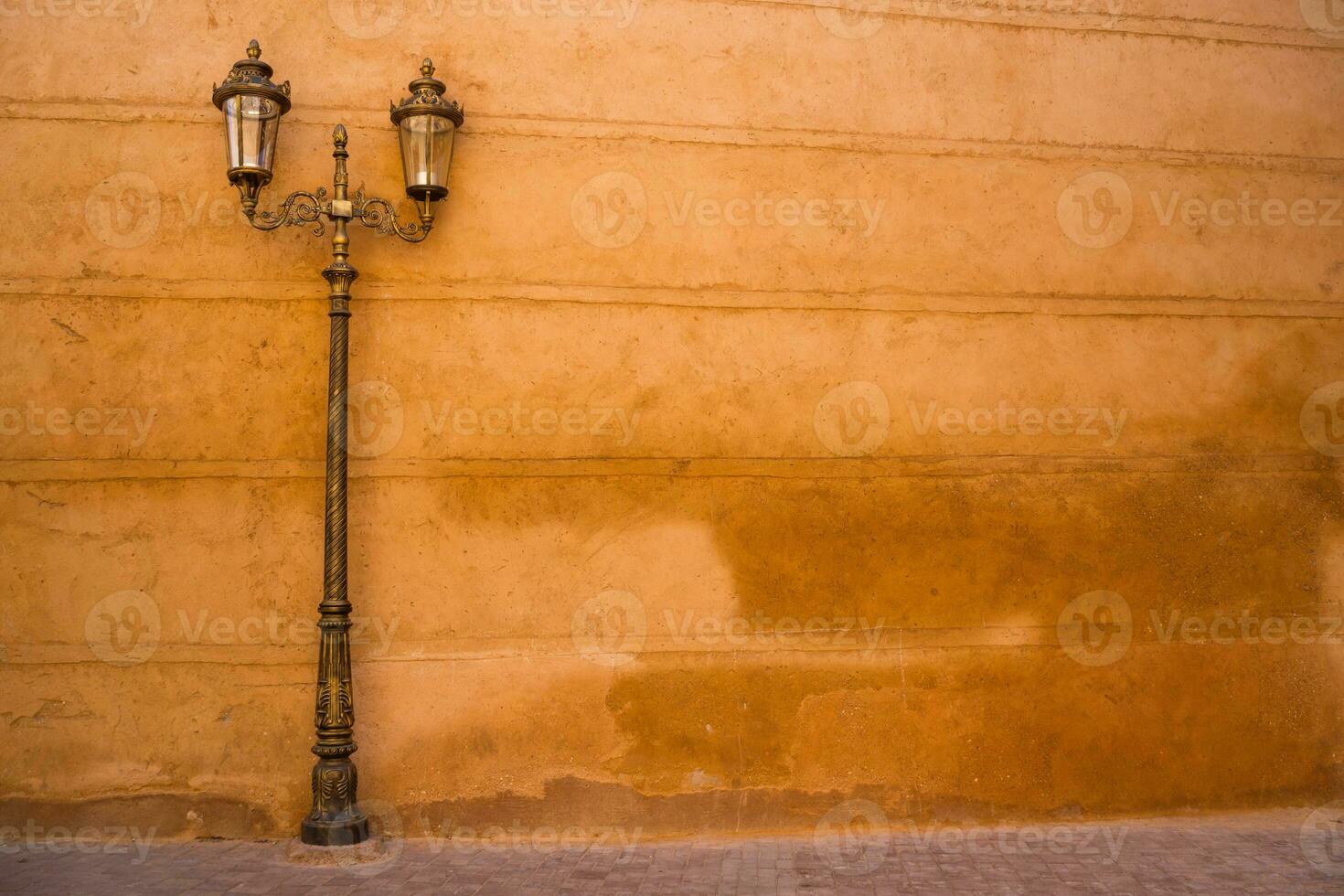 Image of old wall and street lamp in Morocco. photo