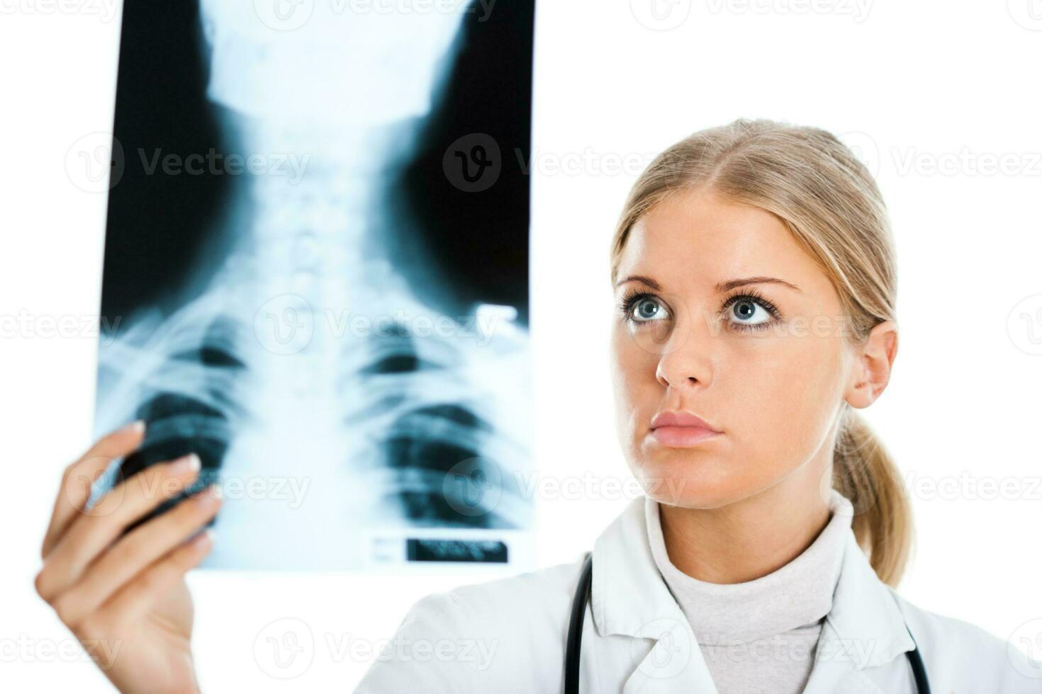 Doctor looking at x ray image photo