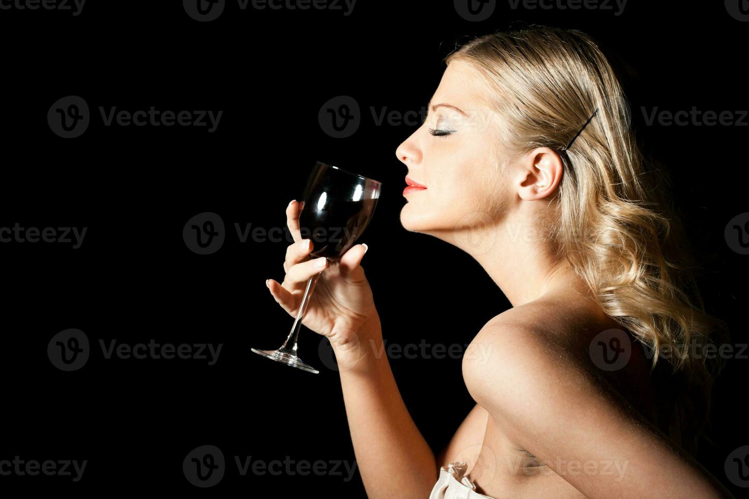 Elegant woman with glass of wine photo