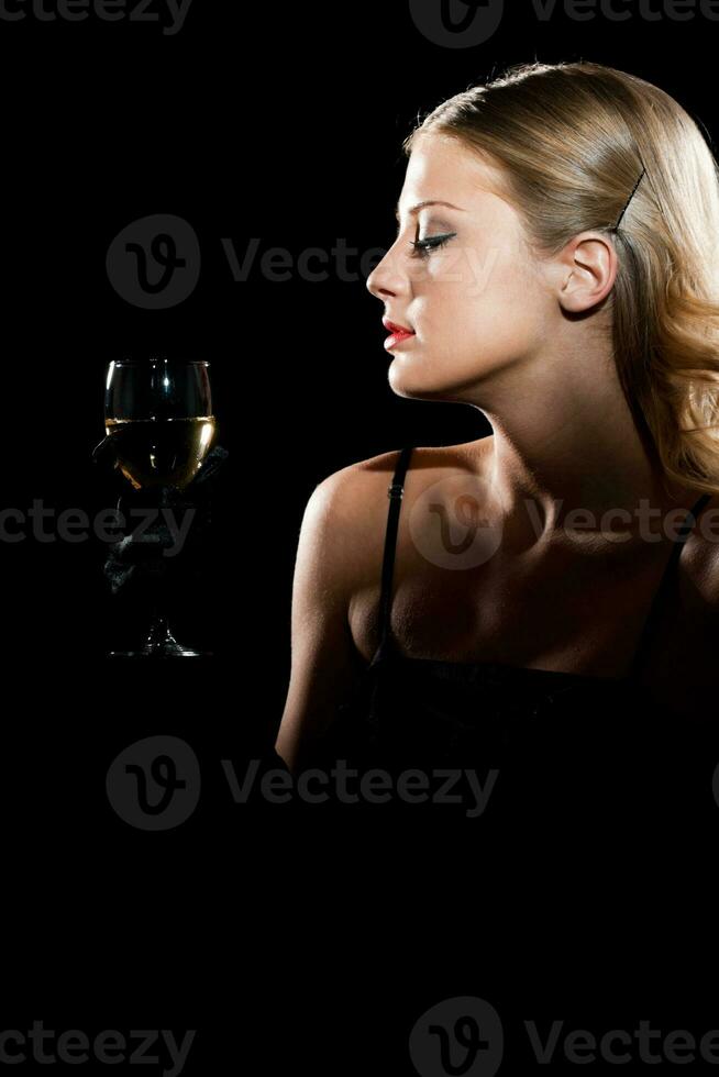 Elegant woman with glass of wine photo