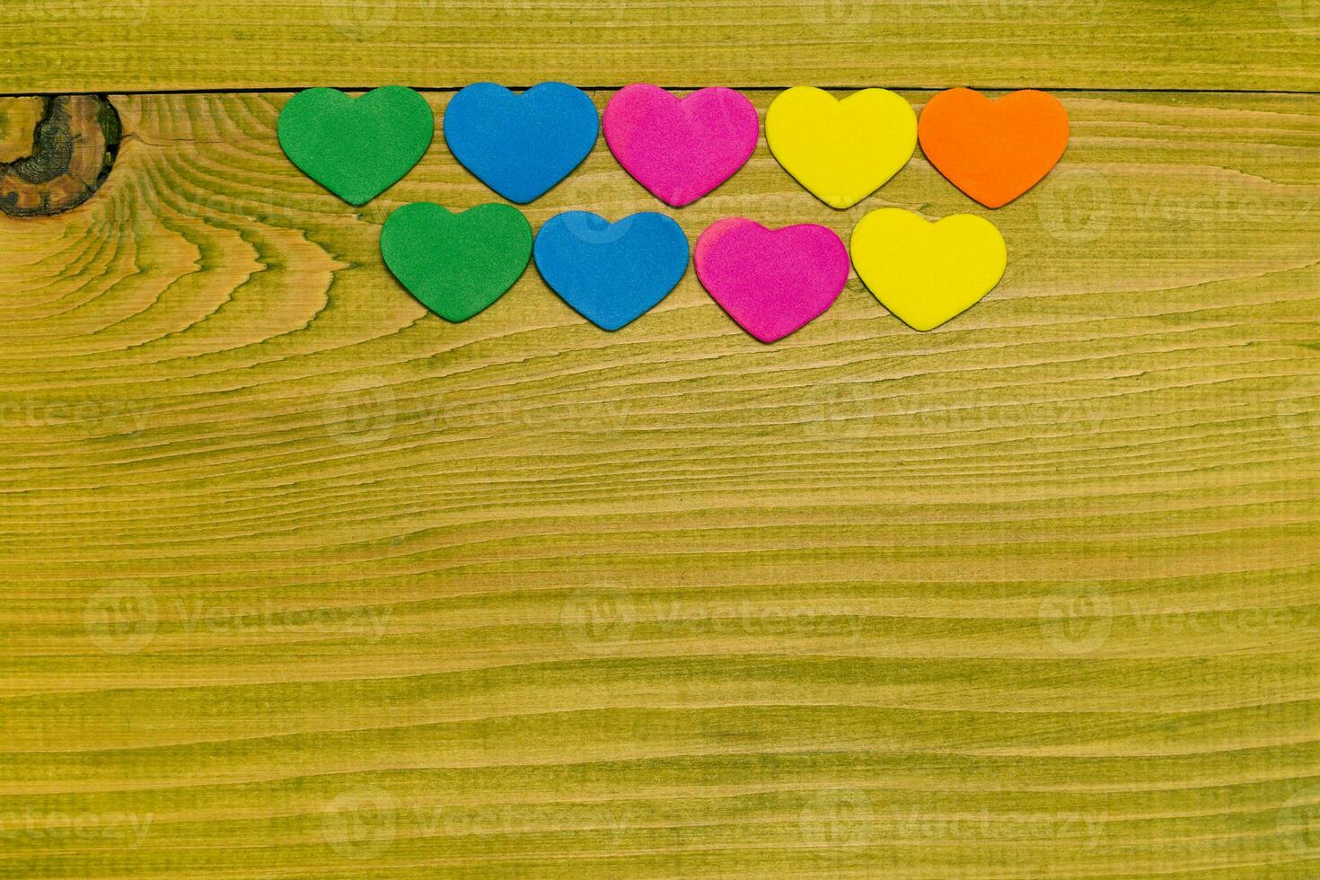 Image of little heart shapes on wooden table.Toned photo. photo