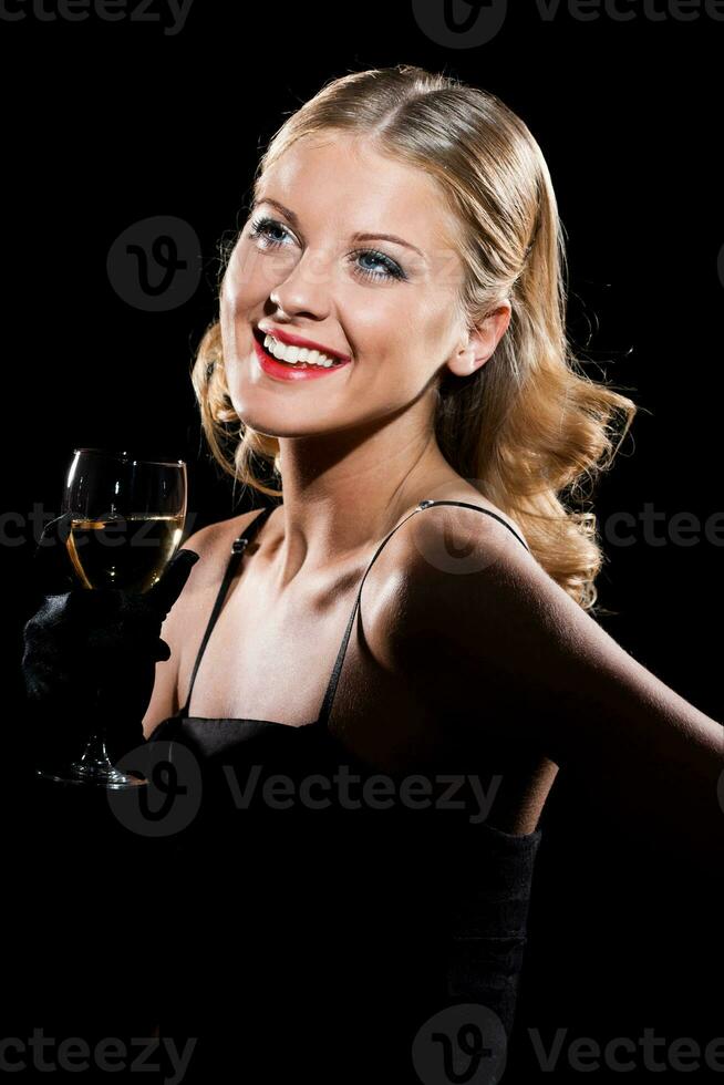Elegant woman with glass of wine photo