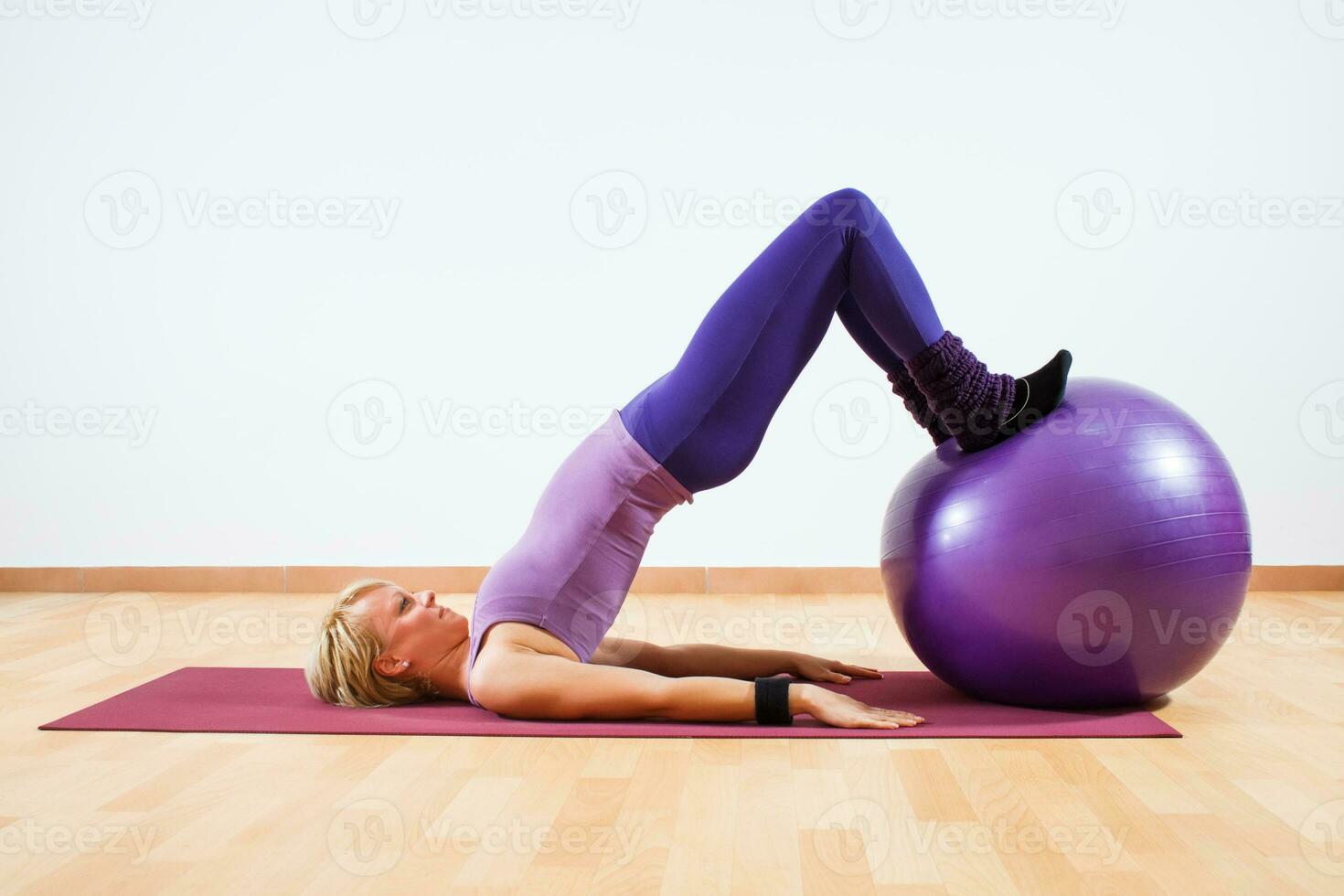 Woman exercise with pilates ball. photo