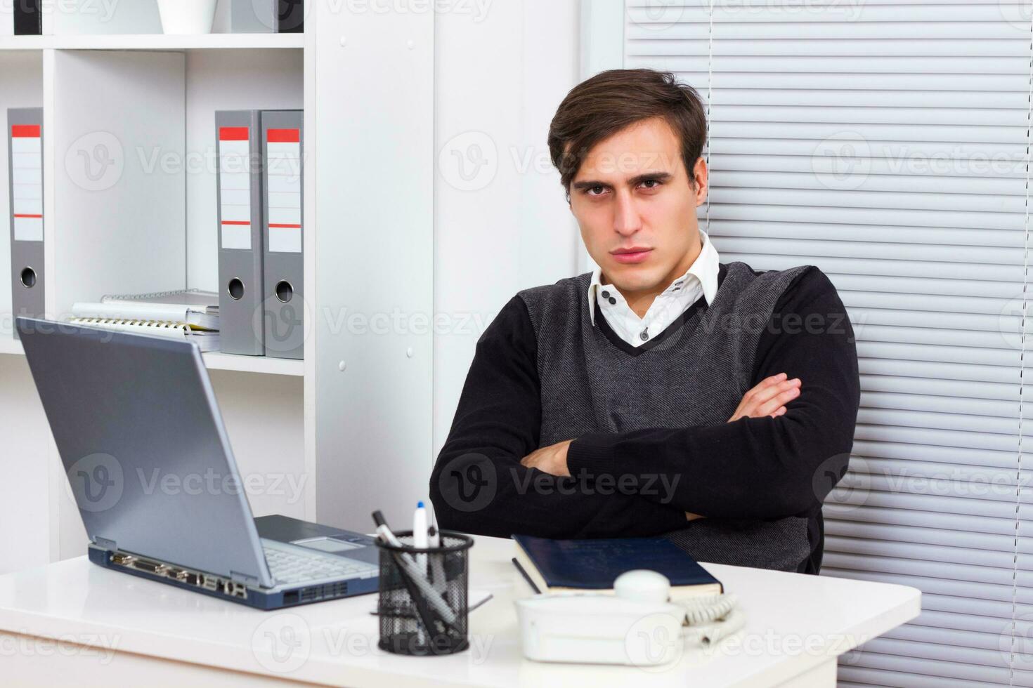 Angry businessman at work photo