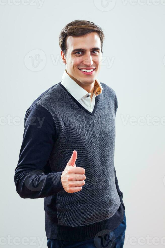 Businessman showing thumb up photo