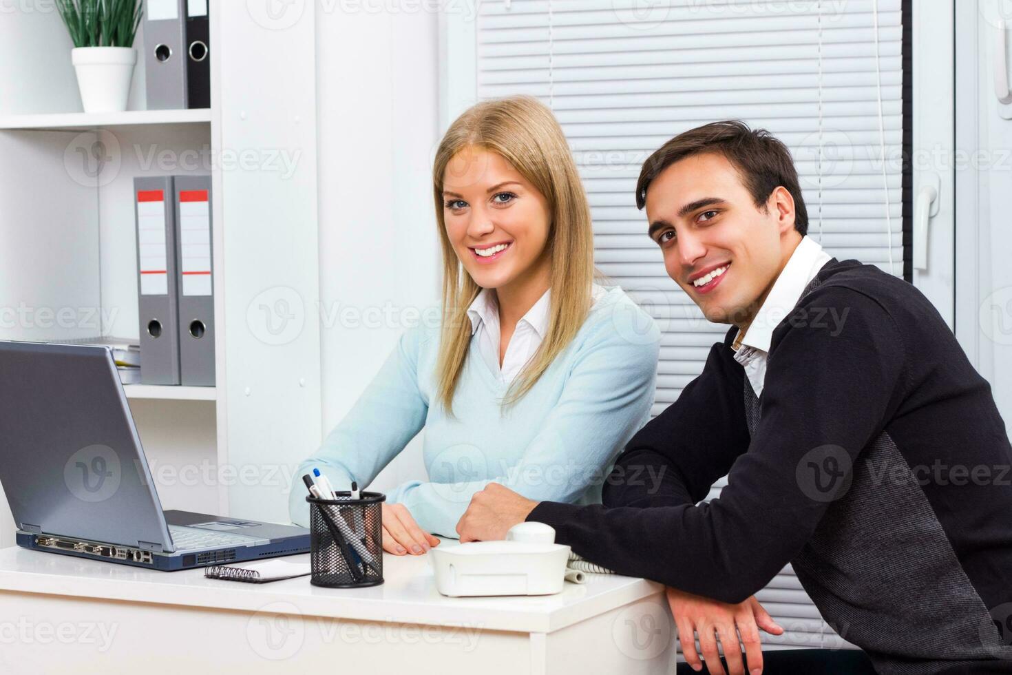 Happy businessman and businesswoman working photo