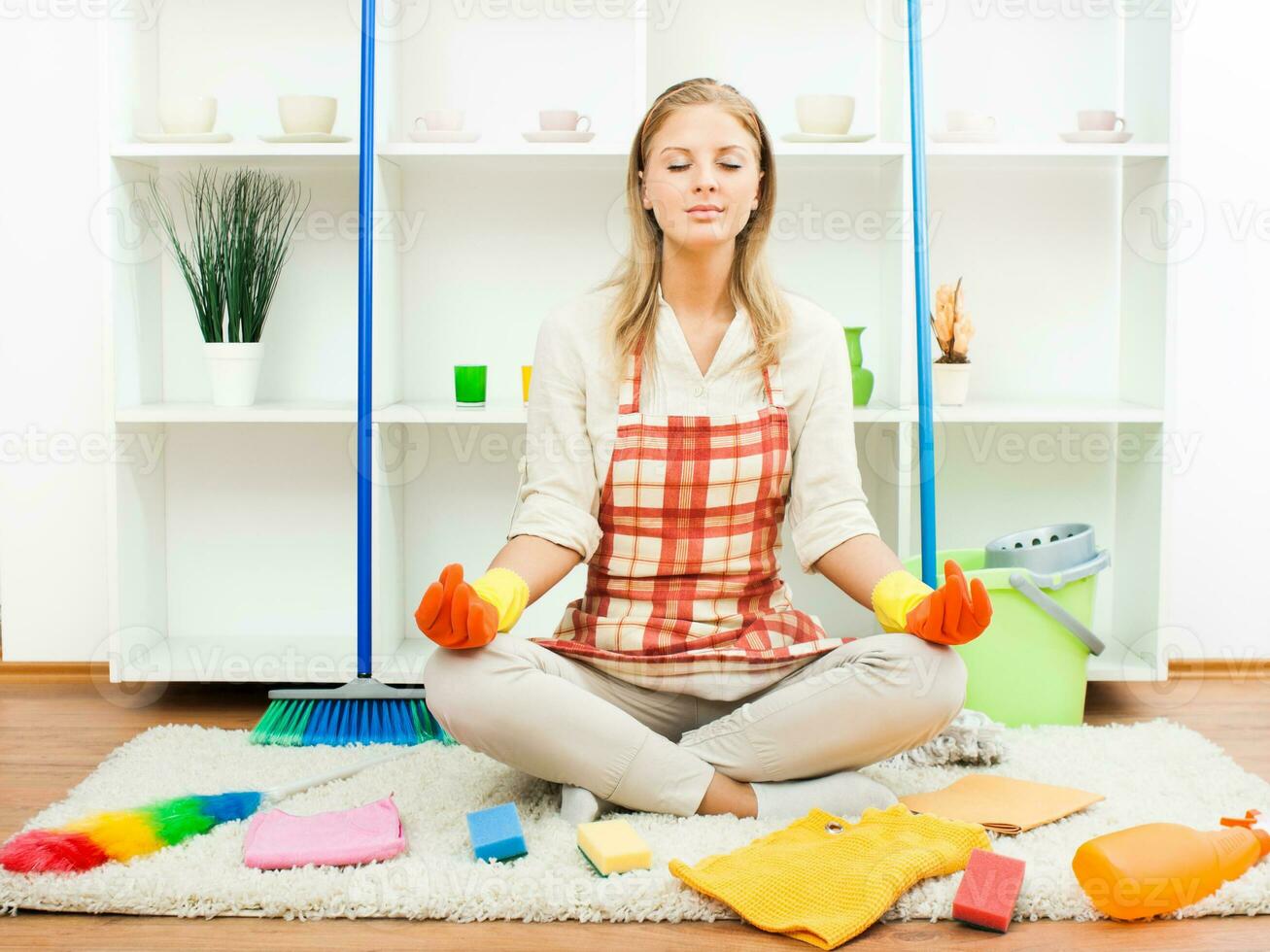 Cute housewife meditating photo