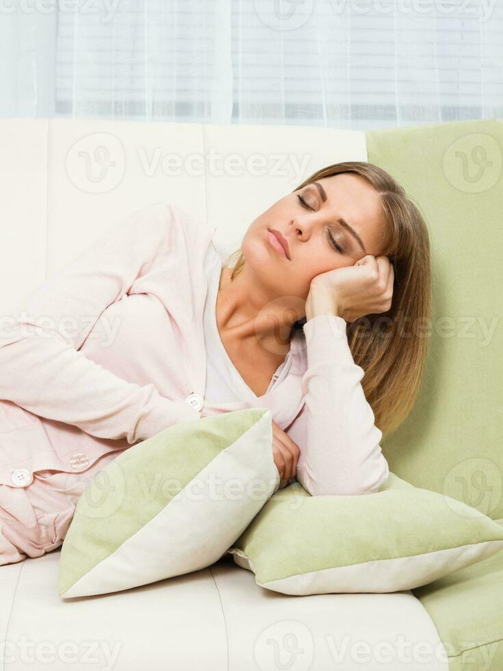 Woman enjoys napping at her home photo