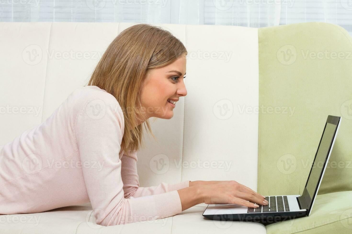 Woman using laptop photo