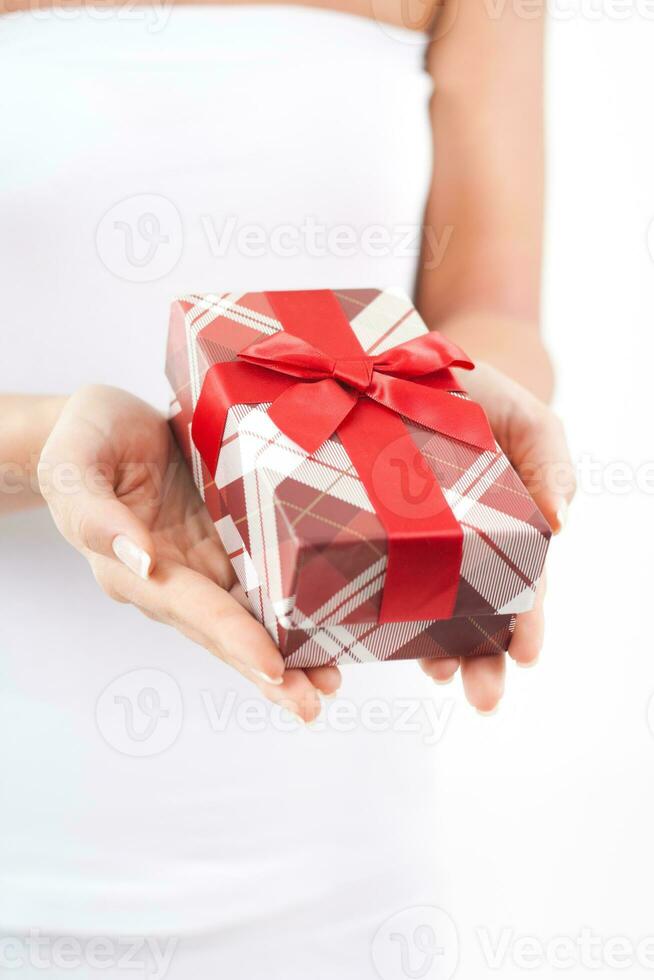 Close up image of woman holding gift box photo