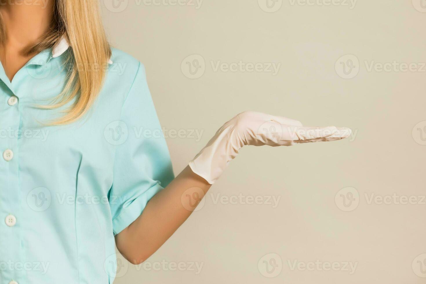 Image of medical nurse showing palm of hand. photo