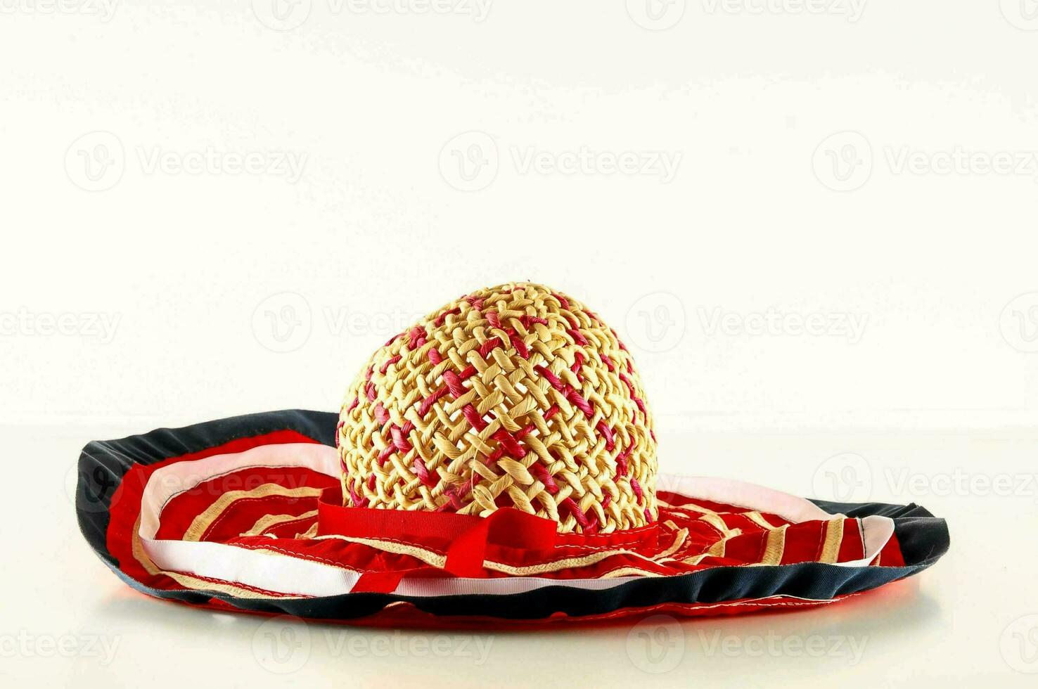 a straw hat with red, white and blue stripes photo