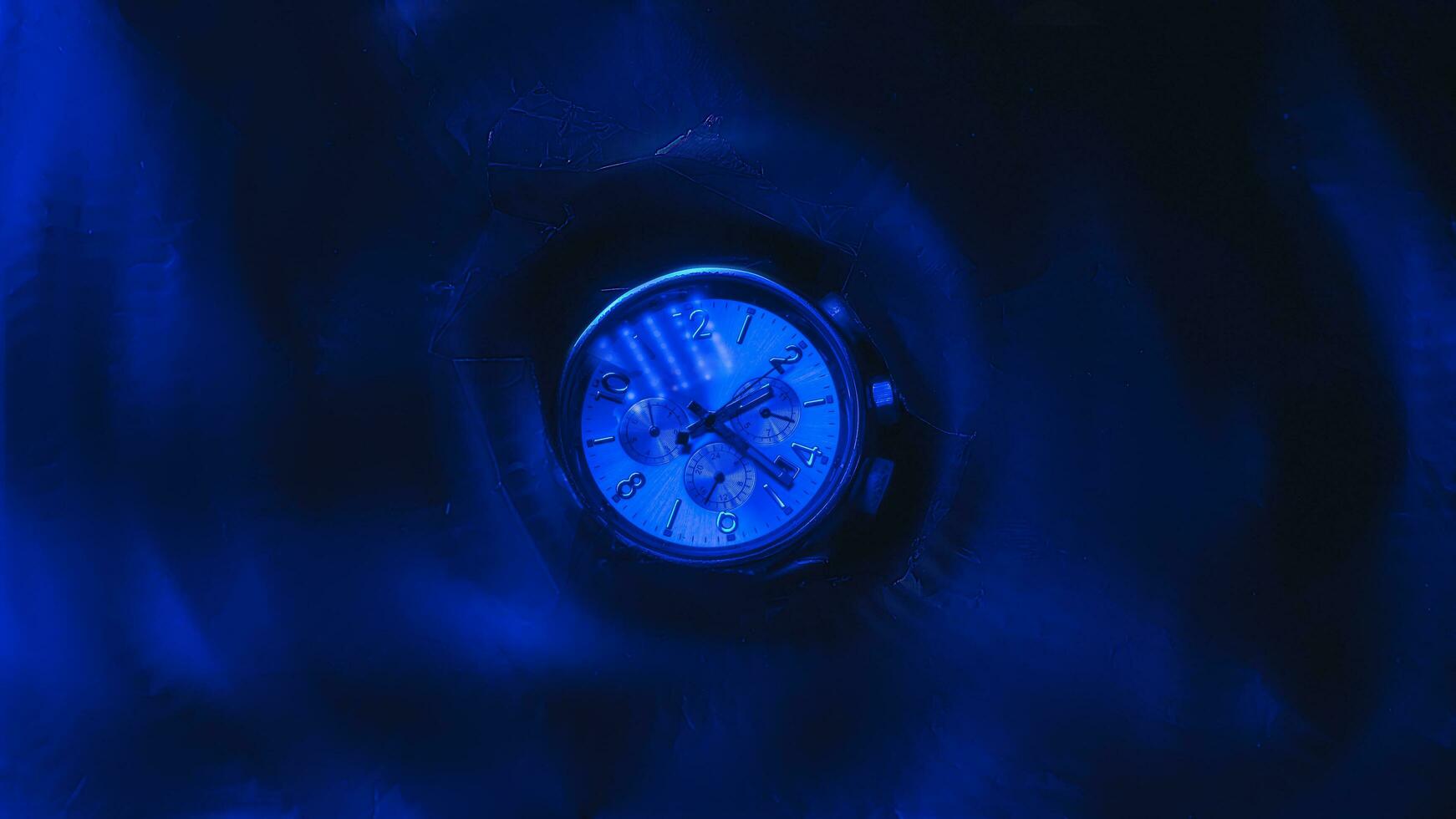 Futuristic illuminated clock in blue color style photo