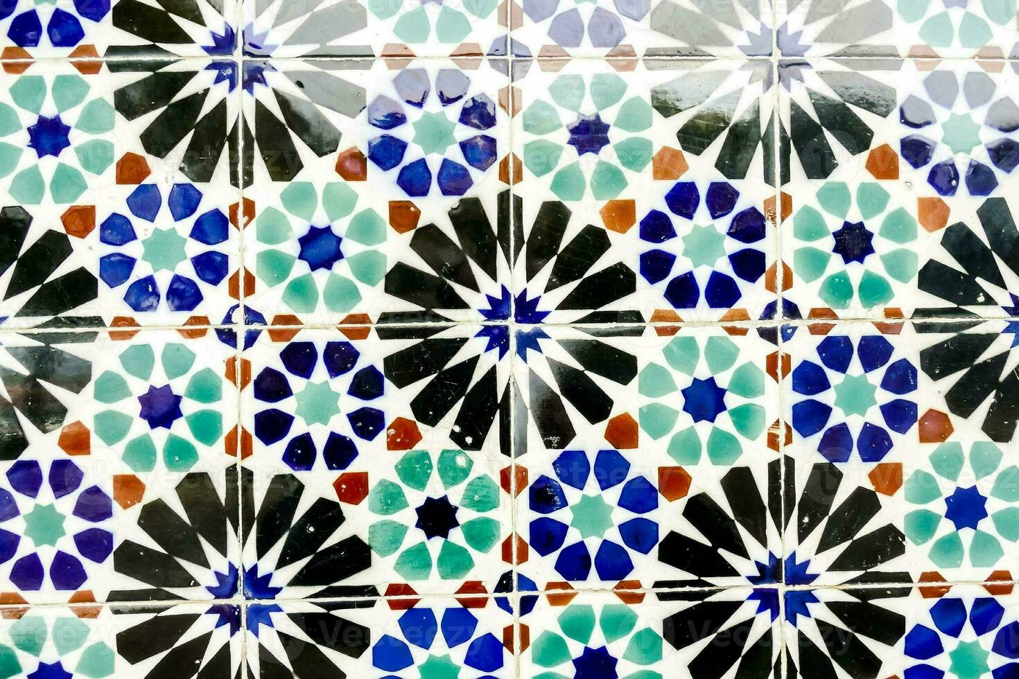 a colorful tile pattern with blue, green and white designs photo