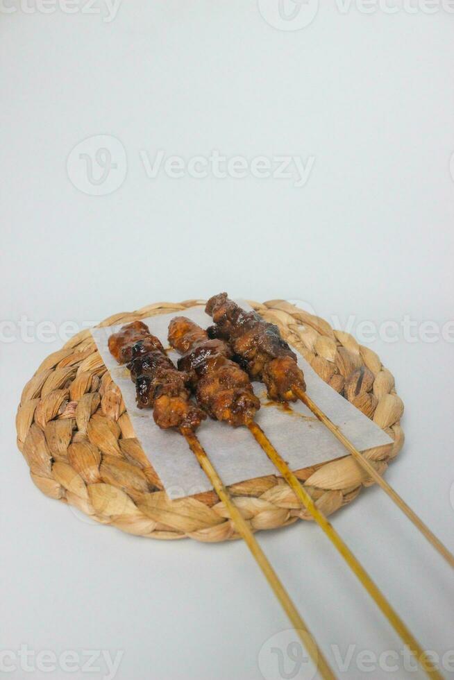 Side view portrait of soy sauce chicken satay on the table photo