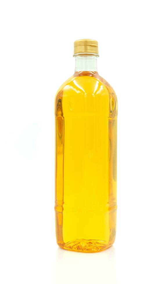Vegetable oil cooking in plastic clear bottle with lid isolated on white background. photo