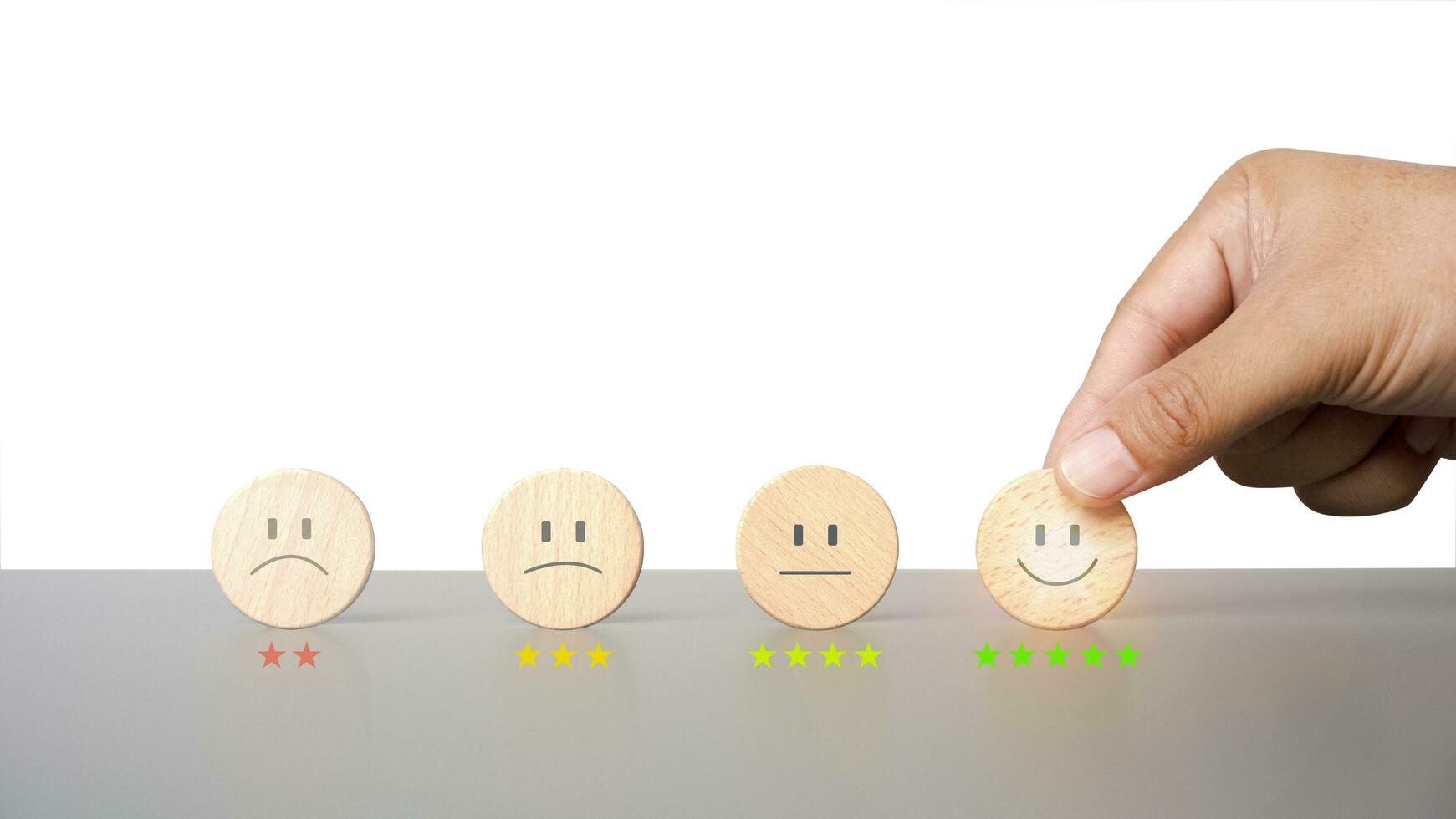 Customer service and Satisfaction concept, Business people choose happy Smiley face icon to give satisfaction in service. rating very impressed. photo