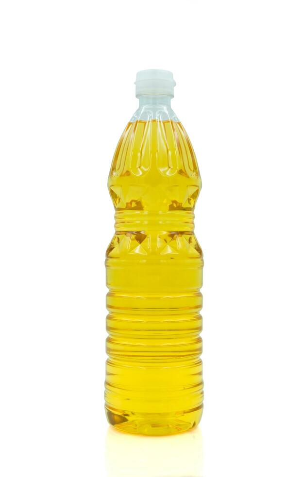 Vegetable oil cooking in plastic clear bottle with lid isolated on white background. photo