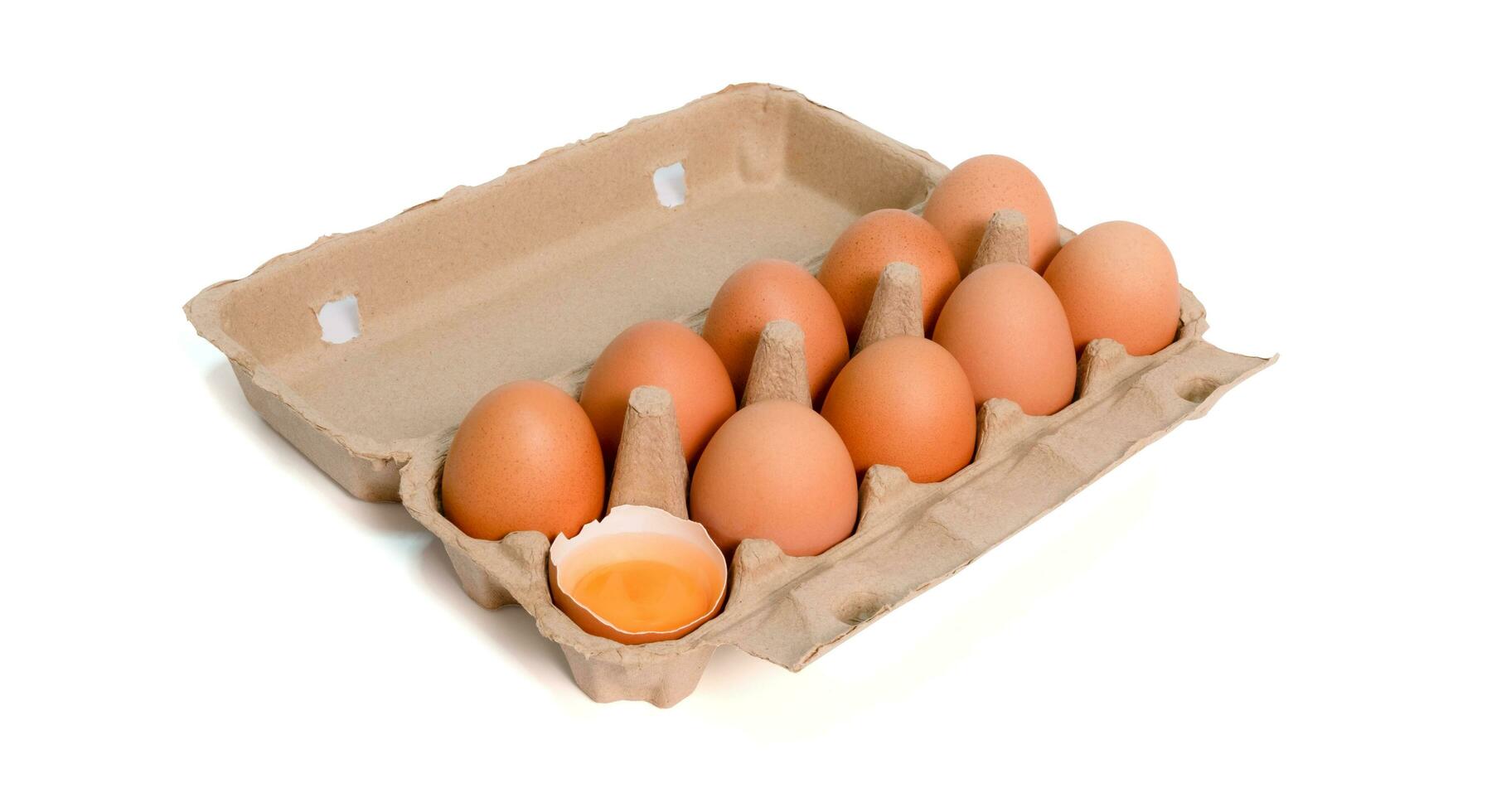 Open box with fresh brown eggs isolated on white background, clipping path. Fresh organic chicken eggs in carton box. photo