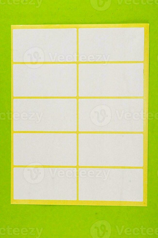 a white sticker with yellow lines on a green background photo