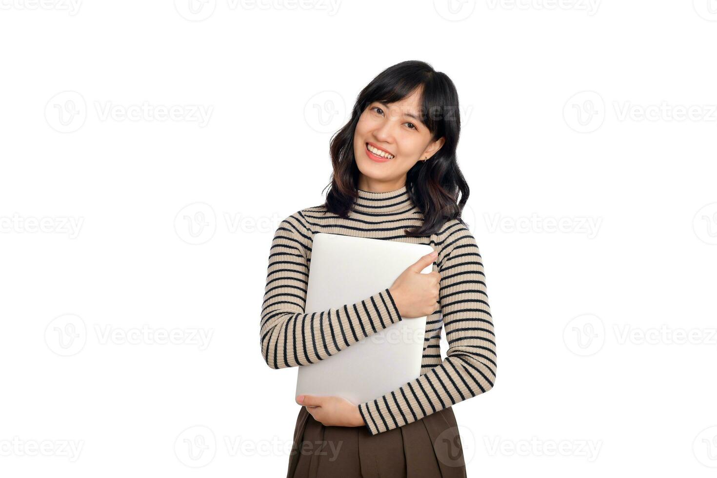 Beautiful young Asian woman on sweater clothing holding laptop pc computer and looking at camera with smile face, isolated on white background photo