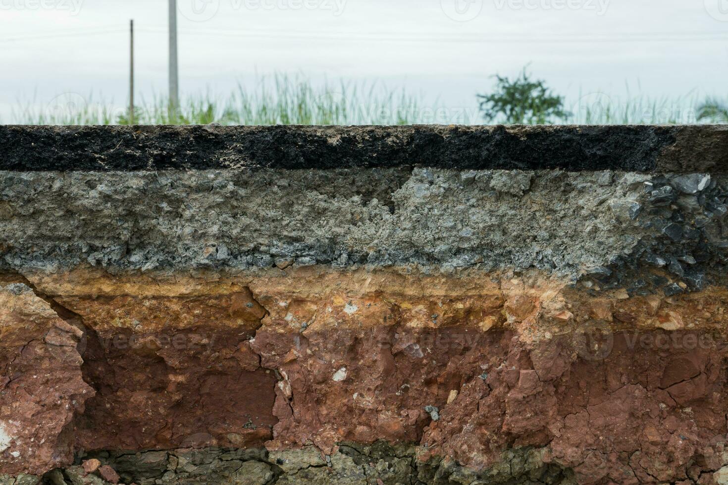 The layer of asphalt road with soil and rock. photo