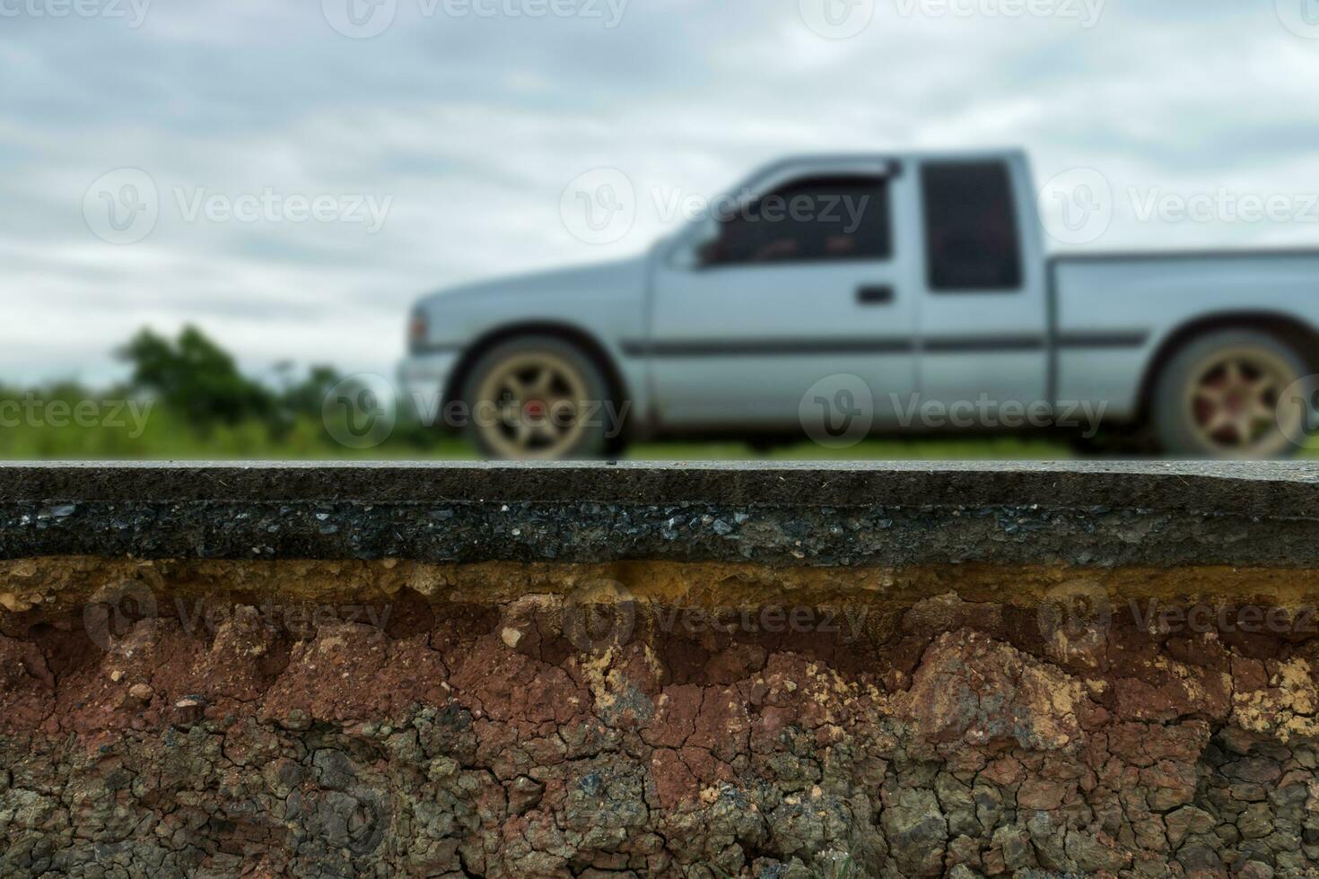 The layer of asphalt road with soil and rock. photo