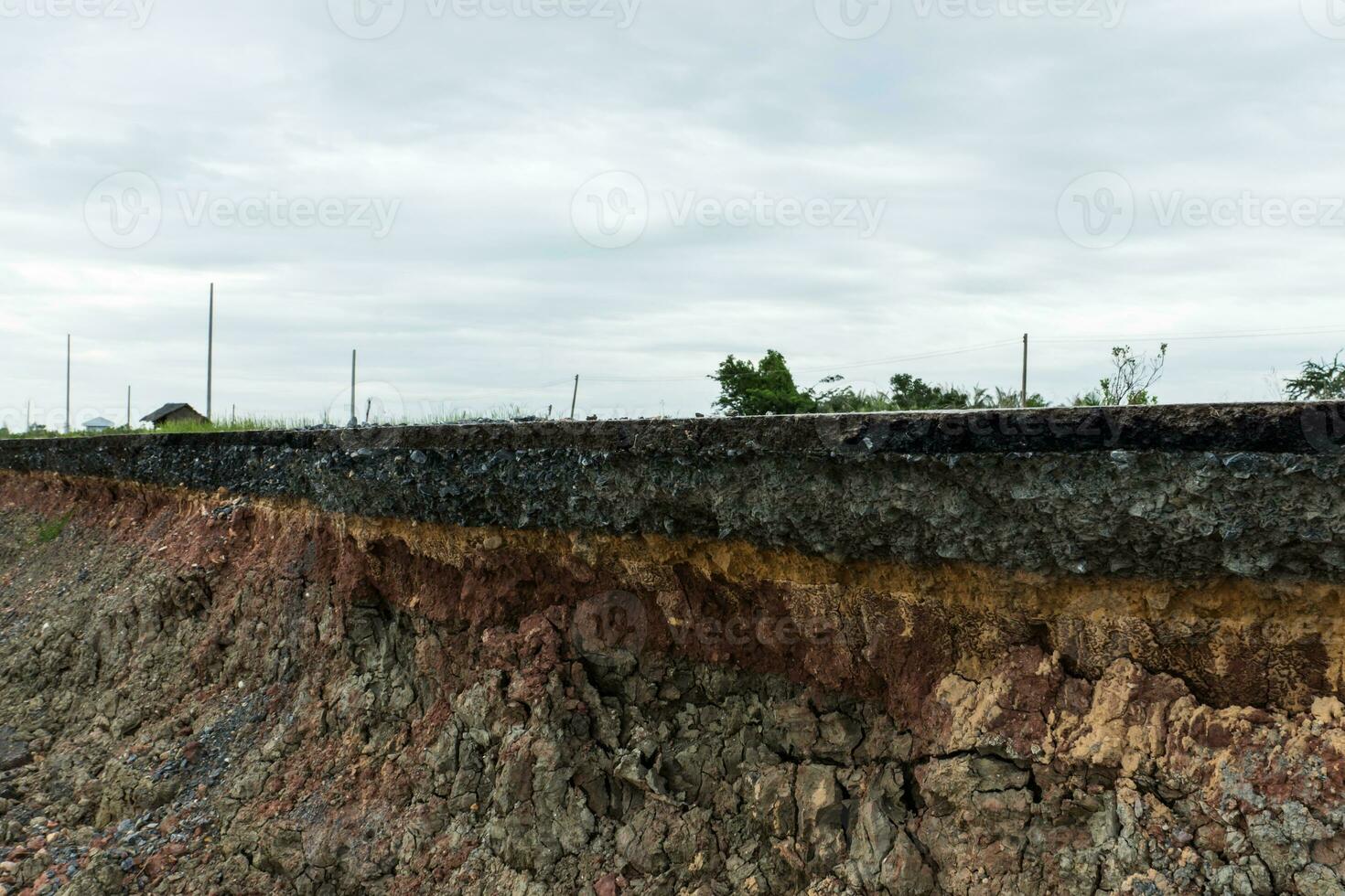 The layer of asphalt road with soil and rock. photo