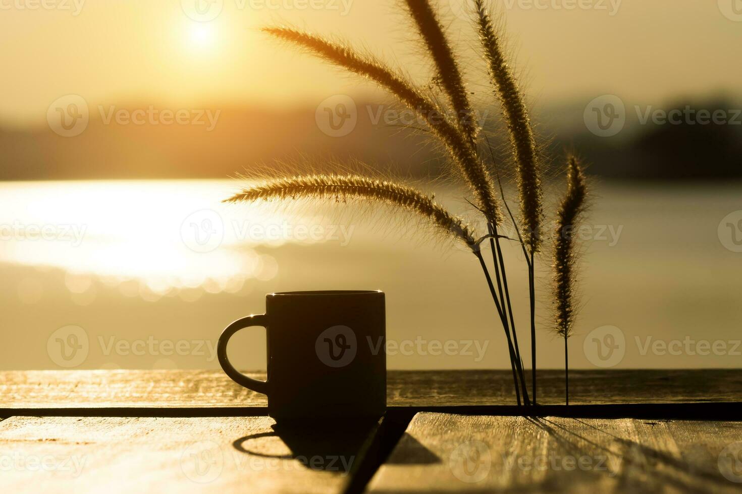 Silhouettes coffee mug in the morning time photo