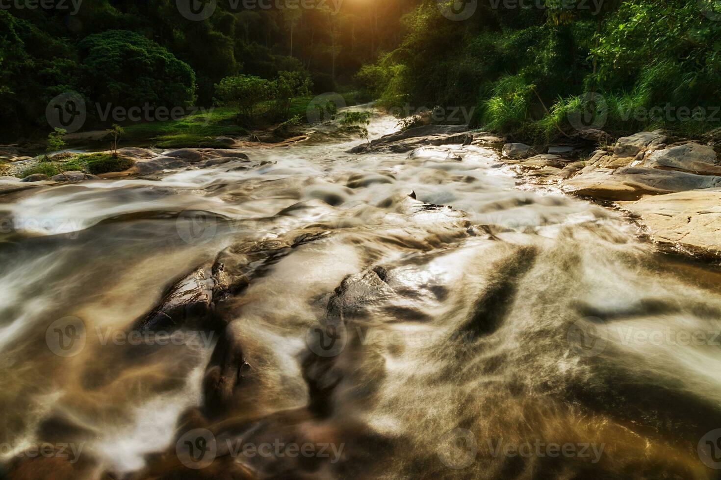 Small waterfall and stone with water motion. photo