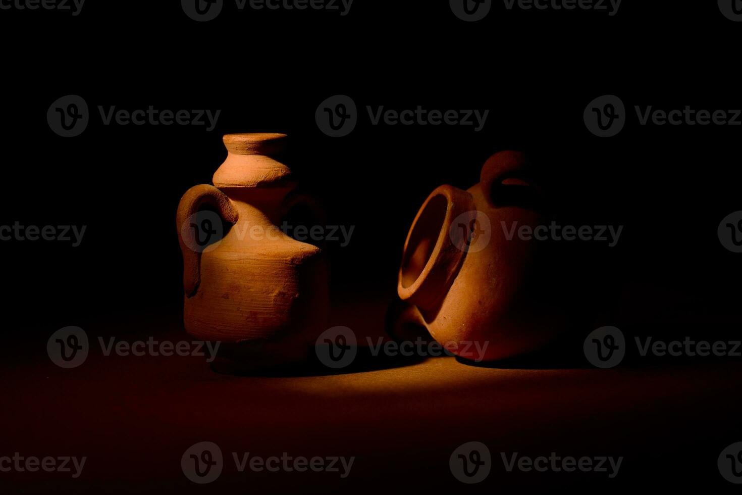 Terracotta amphorae dark background photo
