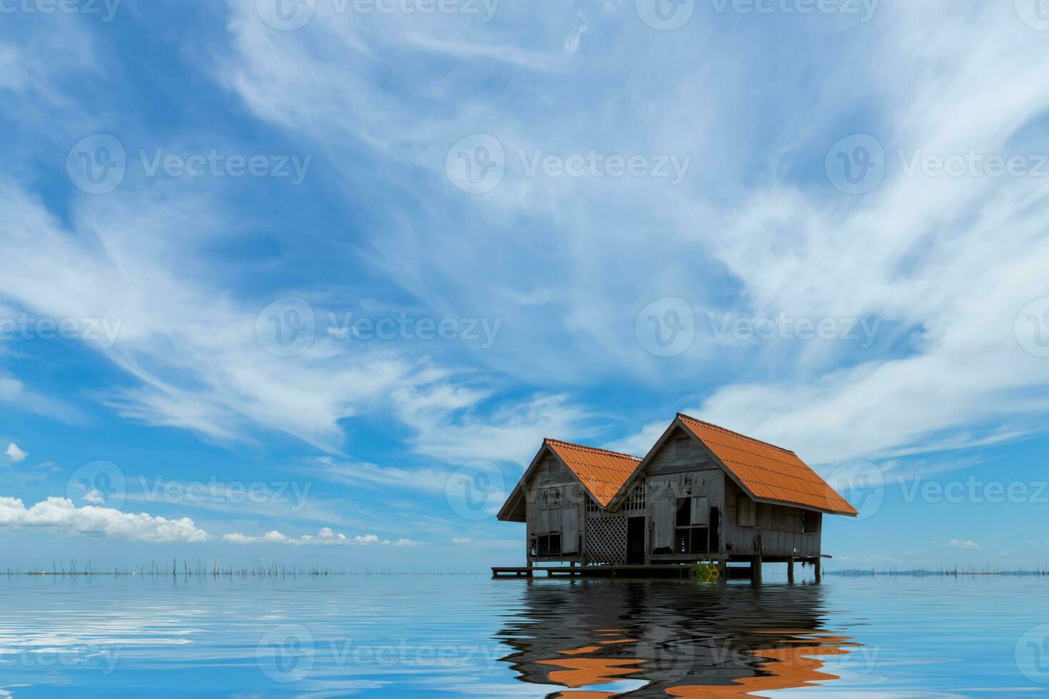 Abandoned house in a secluded area on the lake. photo
