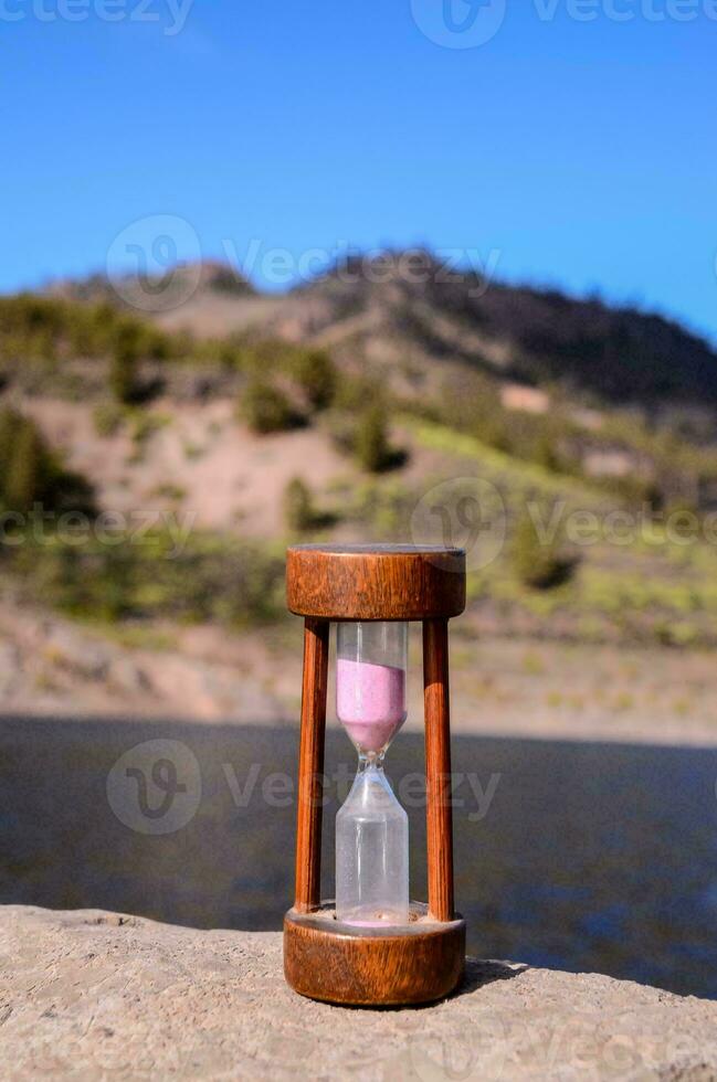 an hourglass on the beach photo