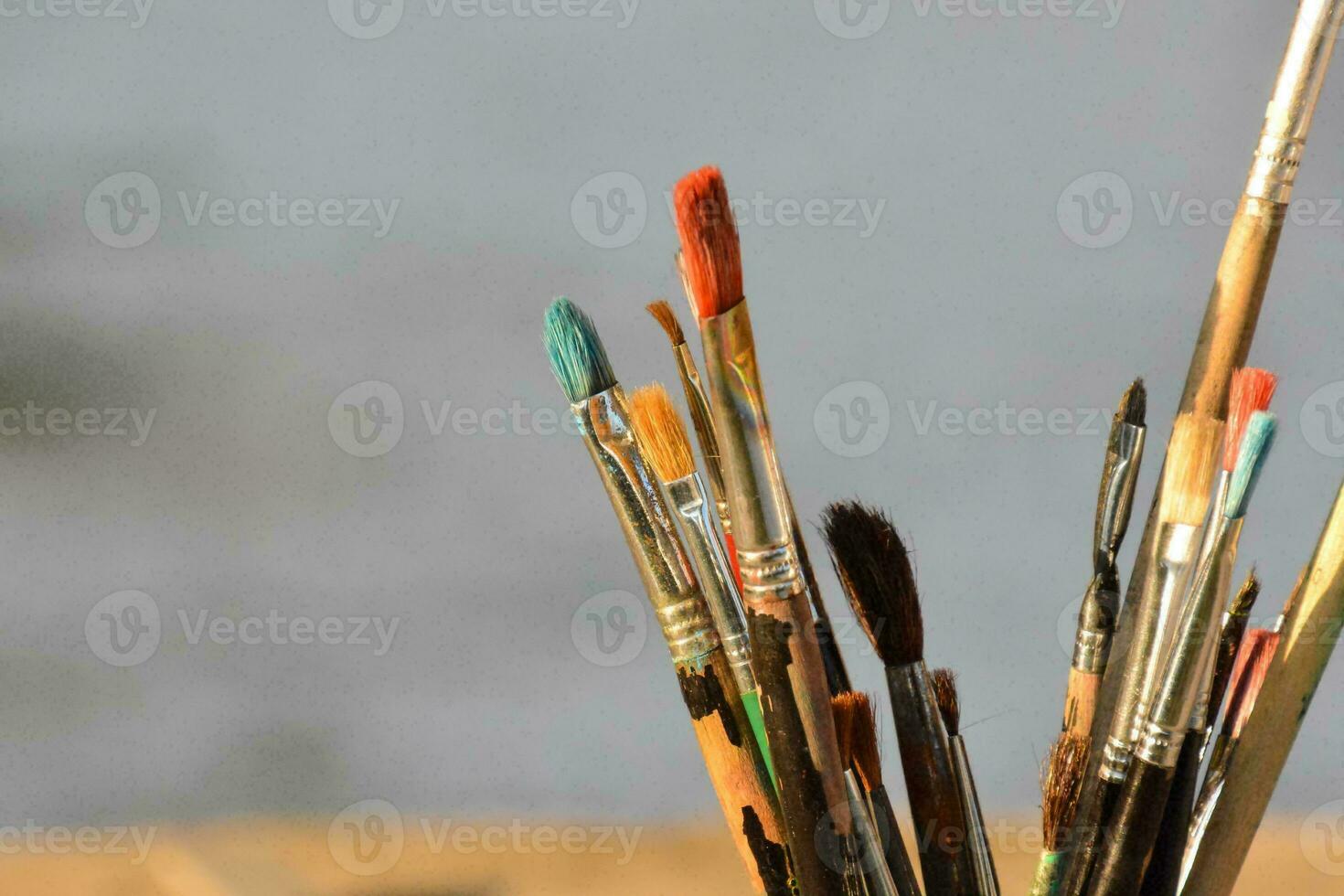 a close up of a bunch of paint brushes photo