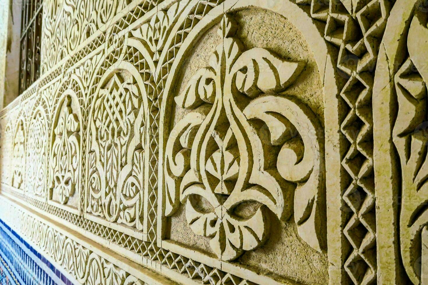 the intricate carvings on the walls of the alhambra palace photo