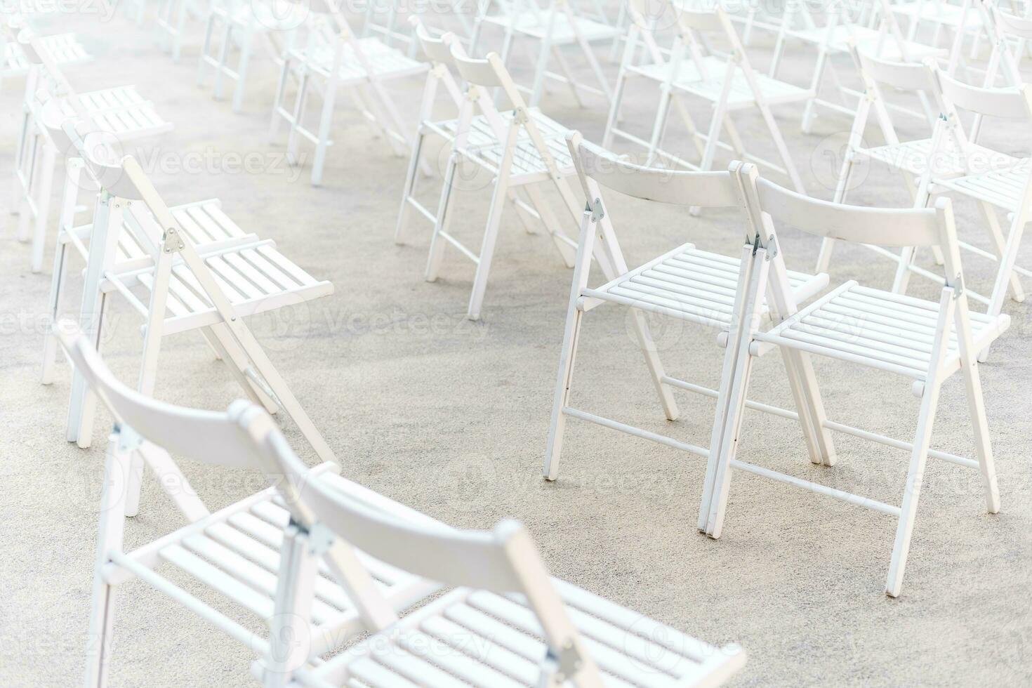Social distancing during Covid or Coronavirus crisis, chairs keeping distance during a show, concert or exhibition, theater or cinema photo