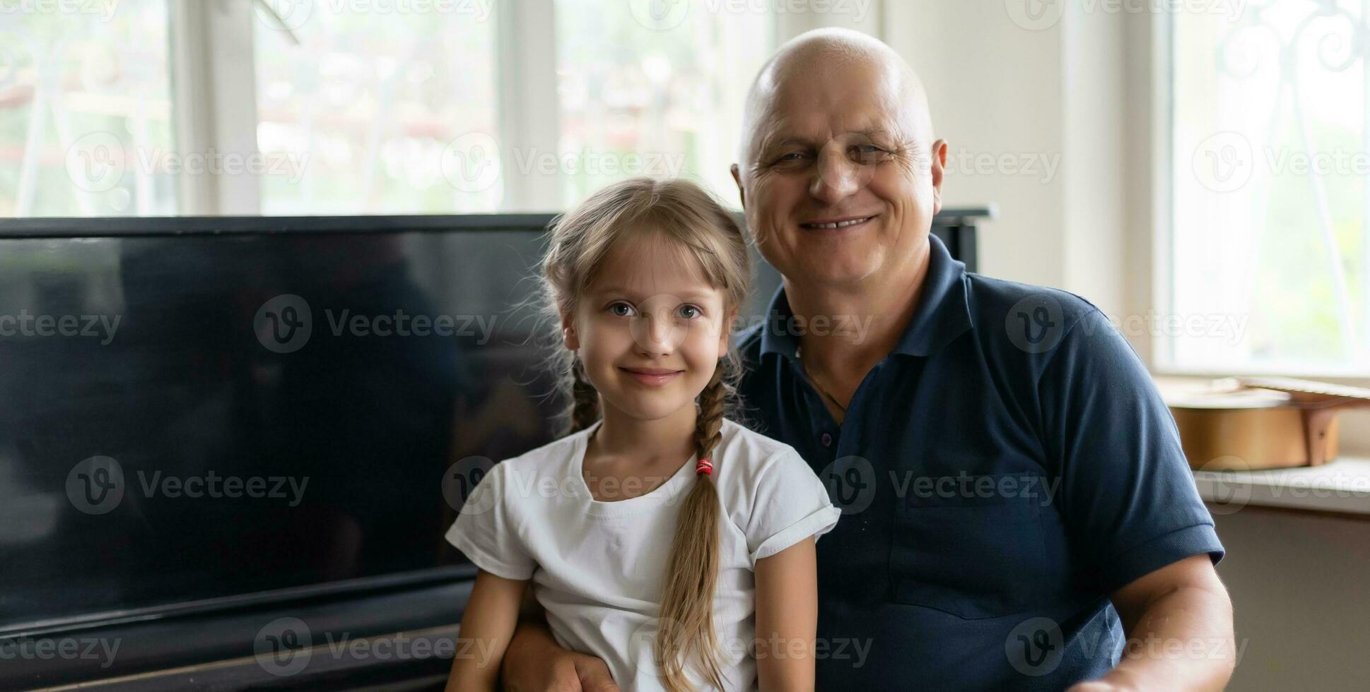 Photo of funny two people old grandpa little interested granddaughter sitting sofa telling good story stay house quarantine safety modern design interior living room indoors