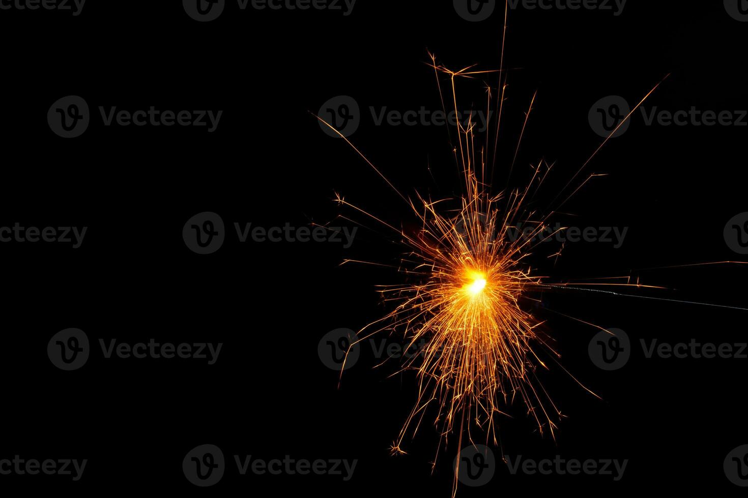A lit sparkler showing bright sparks photo