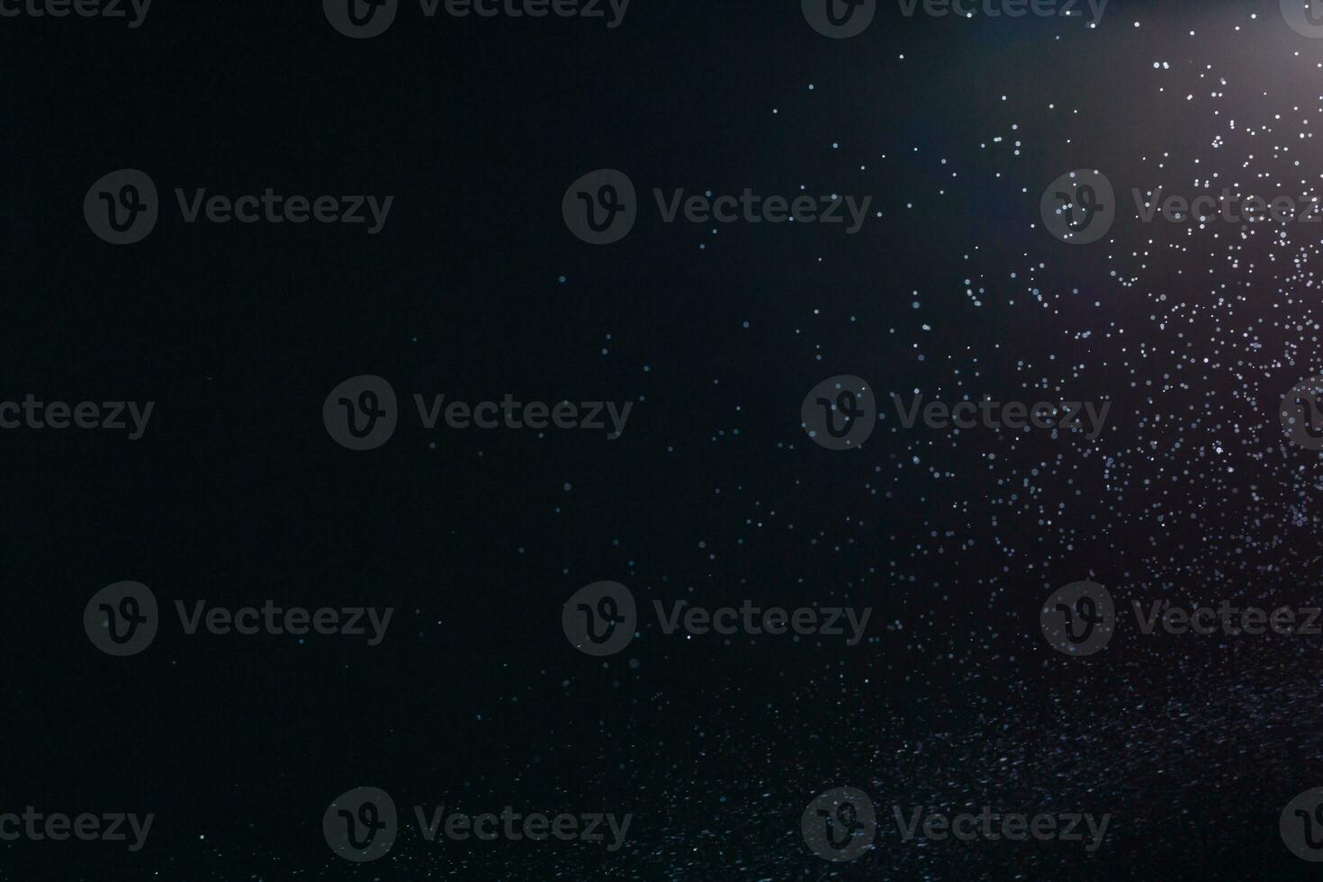 Abstract splashes of water on a black background photo